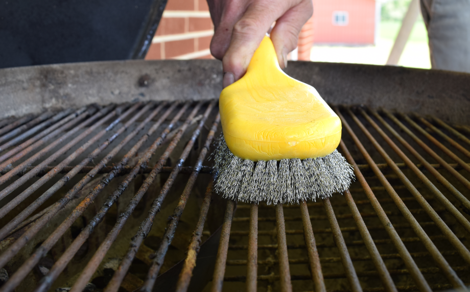 Panini Grill Brush being used on backyard grill